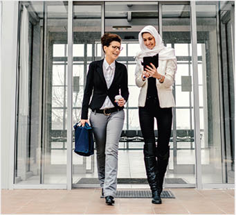 Business people quitting the office building