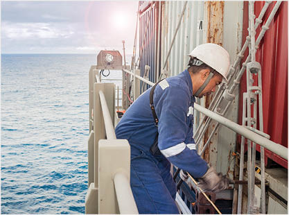 Filipino Worker ship securing container on cargo